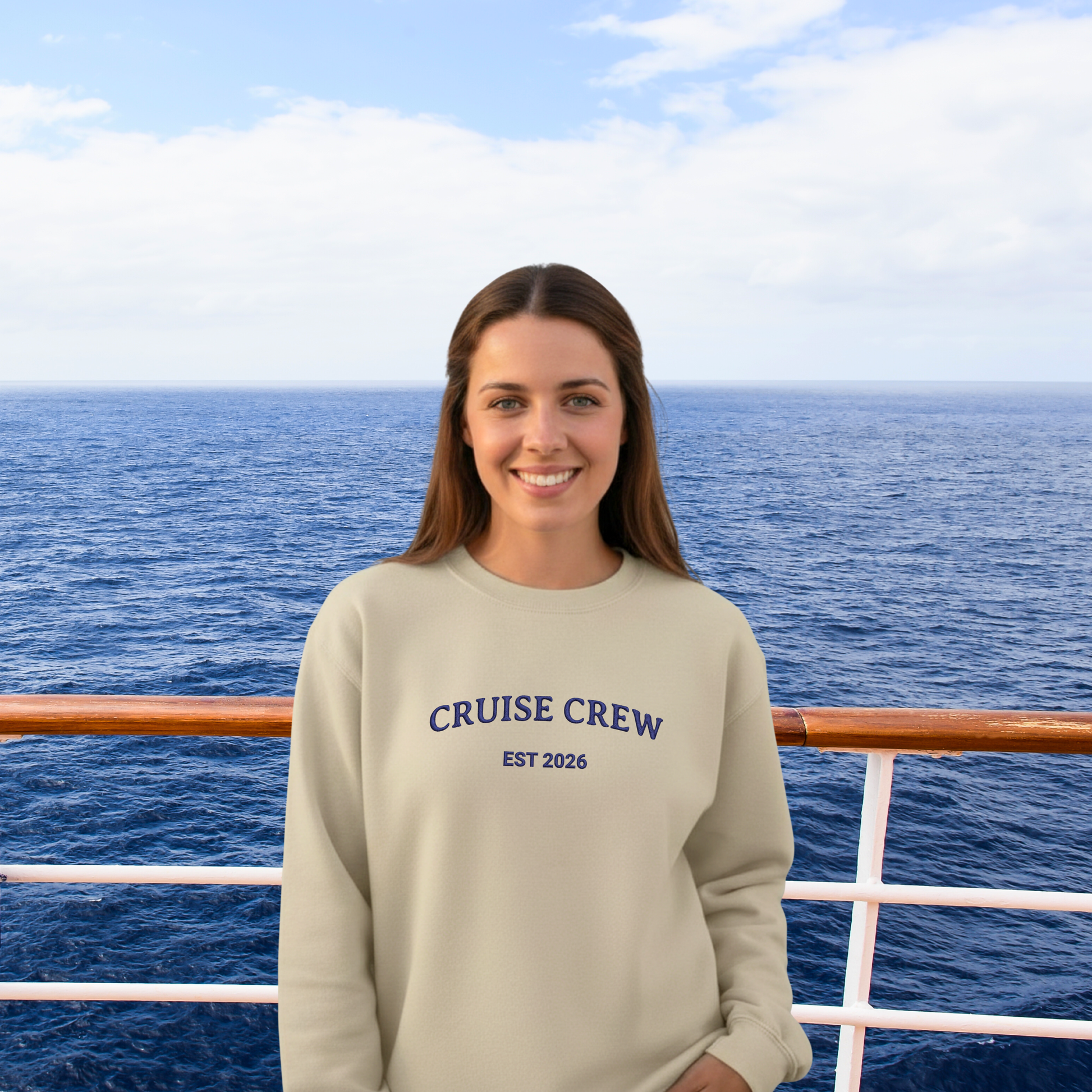 Person wearing a 'Cruise Crew EST 2026' sweatshirt on a cruise ship deck with ocean and sky in the background